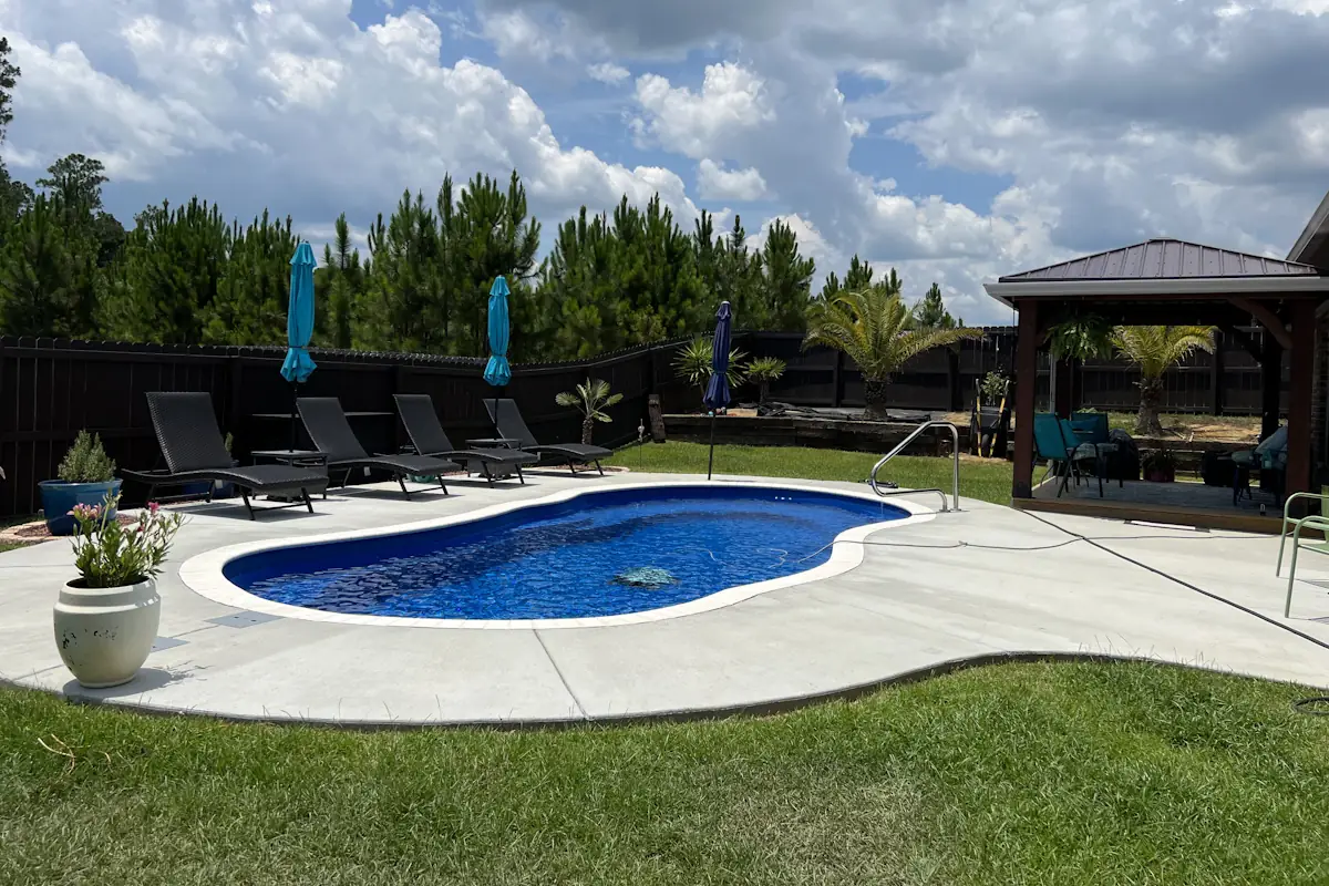 An inground backyard swimming pool installed by Backyard Paradise Pools