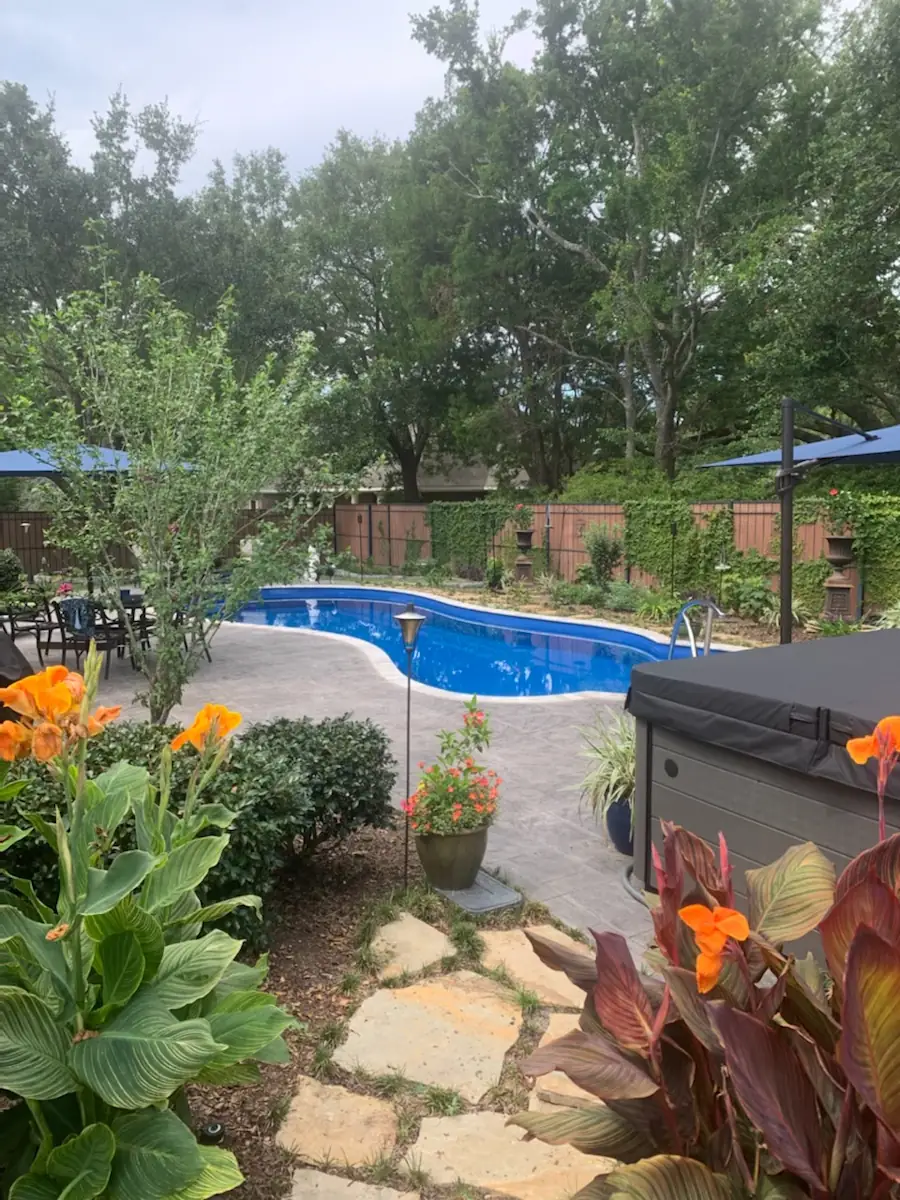 A backyard swimming pool installed by Backyard Paradise Pools