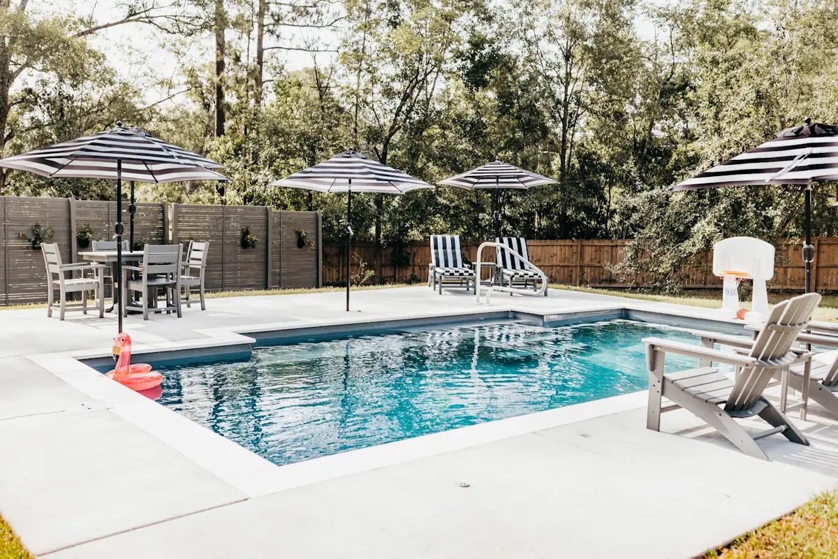An inground backyard swimming pool installed by Backyard Paradise Pools